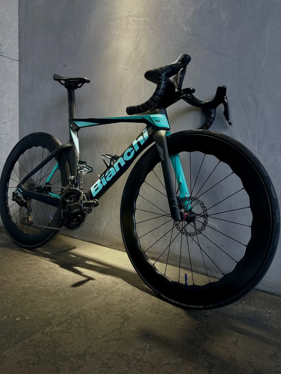 A completed celeste Bianchi road bike in the Velox workshop