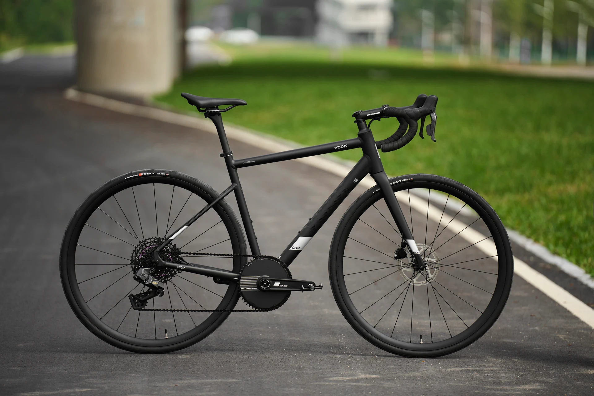 Black VOOK One 3.0 road bike shown from the drivetrain side on an outdoor path