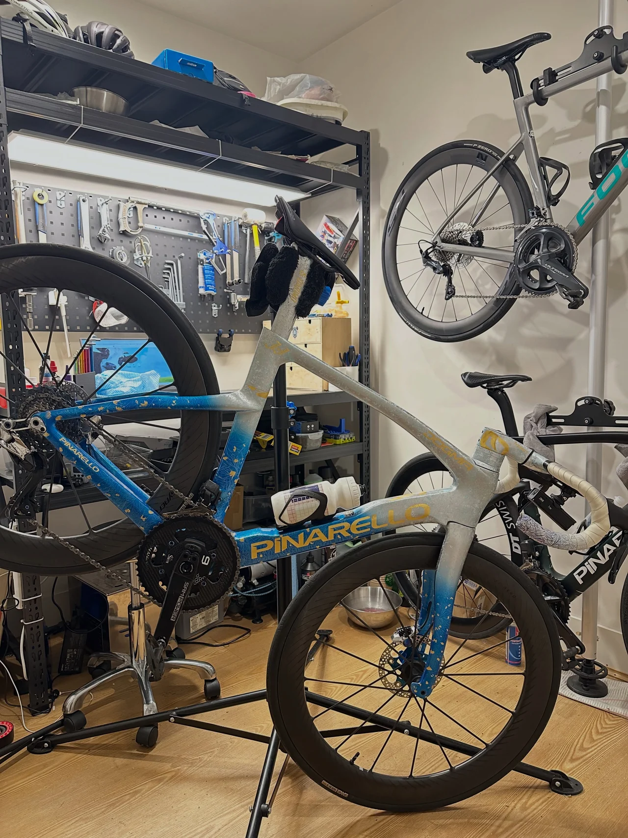A road bike on the repair stand inside the Velox workshop